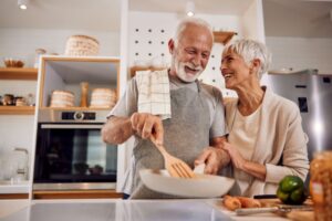 Healthy senior couple preparing a meal together